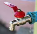 Image of a water tap with red handle. Source: pixabay.com