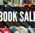 The words "Book Sale" above books on a table