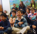 Children smiling in the Austin Room at the Library during storytime 
