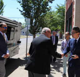 City Manager Will Worthey greets Naoki Kuze, CEO of St. Cousair