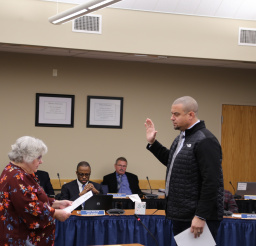 Councilor Derek Carmon swears the oath of office