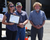 Lacey Dykgraaf with Russ Thomas and Mayor Rick Rogers