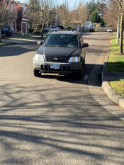 Car parked far away from the curb