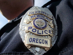 A Newberg-Dundee Police badge on an officer