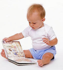 Baby reading a book image.