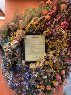 Rainbow flower art installation around city proclamation for June as Pride month in Newberg.