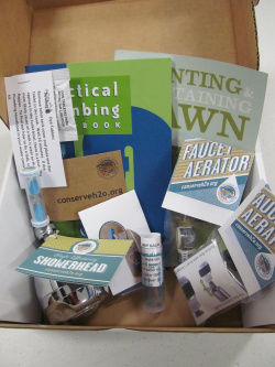 A water efficiency kit including things like pamphlets and a shower head